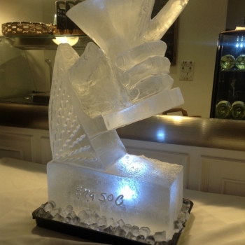 side angle view of a Hand holding a Martini Glass Vodka Luge from Passion for Ice