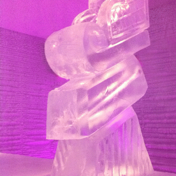 Sleigh Vodka Luge from Passion for Ice bathed in pink lighting