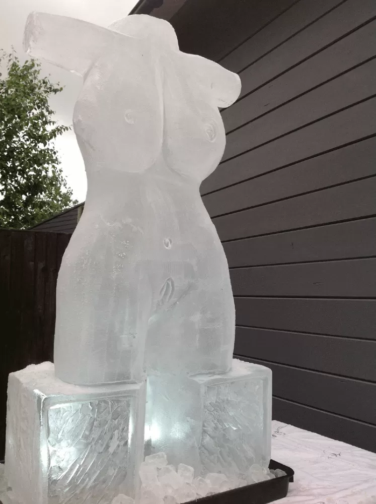 Side view of Female Torso Vodka Luge from Passion for Ice