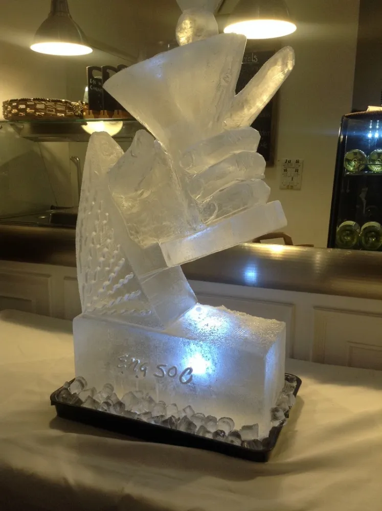 side angle view of a Hand holding a Martini Glass Vodka Luge from Passion for Ice